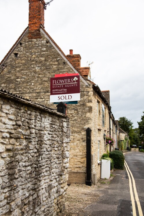 House with sold sign